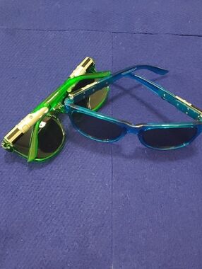 2 Pairs Kids Lightsaber Sunglasses. One Blue, One Green. Great Condition.